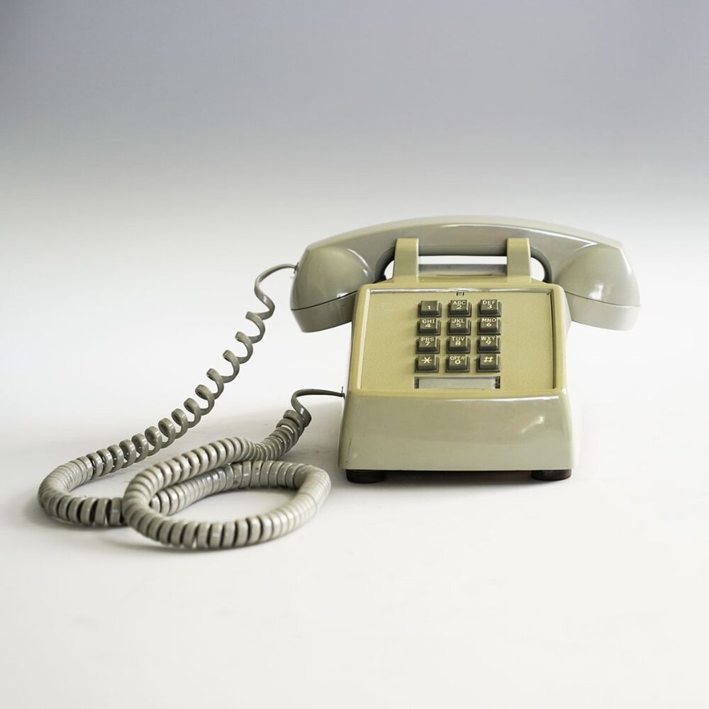 Premier 2500, vintage push-button desk phone.